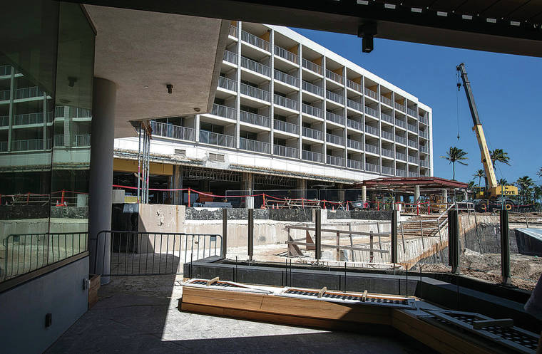 CINDY ELLEN RUSSELL / CRUSSELL@STARADVERTISER.COM
                                Above, a view of construction toward the hotel’s south wing.