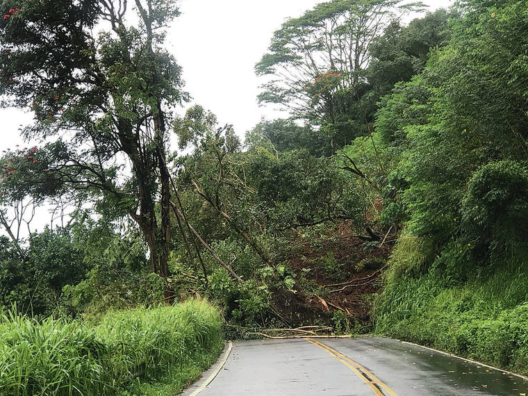 COURTESY PHOTO
                                A landslide Thursday covered Kuhio Highway on Kauai, isolating Hanalei. Officials foresee the highway remaining closed through at least Tuesday.