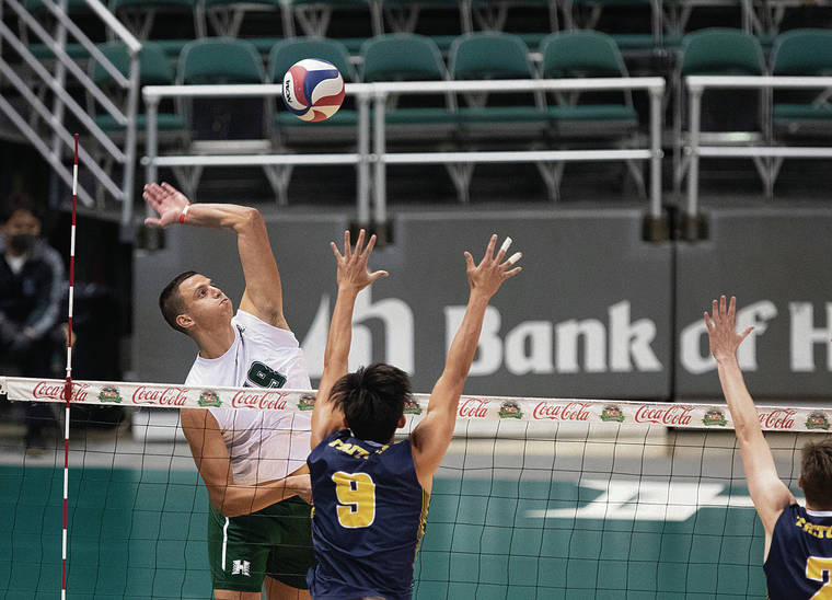 CINDY ELLEN RUSSELL / CRUSSELL@STARADVERTISER.COM
                                Hawaii opposite Rado Parapunov rose for a kill as UC San Diego outside hitter Ryan Ka (9) went to block during the first set of Friday’s match at the SimpliFi Arena at Stan Sheriff Center.