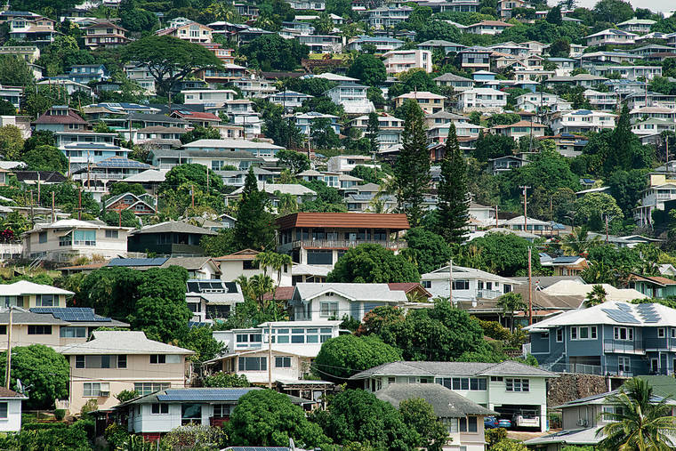CRAIG T. KOJIMA / CKOJIMA@STARADVERTISER.COM
                                The median price of a home on Oahu reached $900,000 last month.