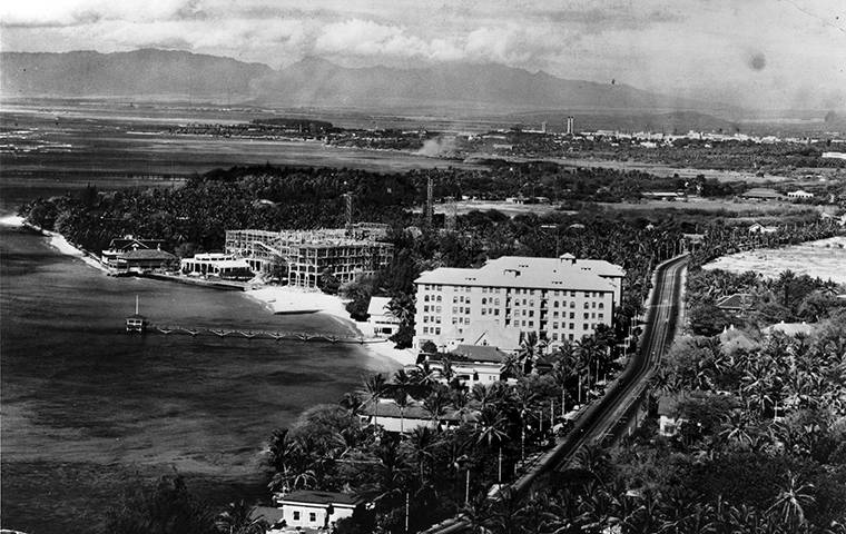 PHOTO BY 11TH PHOTO SEC., AIR SERVICE, U.S. ARMY, COURTESY SAVE OUR SURF
                                <strong>Looking back </strong>
                                <em>Waikiki beach, 1925</em>
                                Seawalls cause beach erosion, as visible in front of the Royal Hawaiian Hotel under construction. After the Royal Hawaiian groin was built in 1927, sand accumulated in front of the Royal but disappeared from other areas of the beach Ewa of the Royal Hawaiian Hotel.