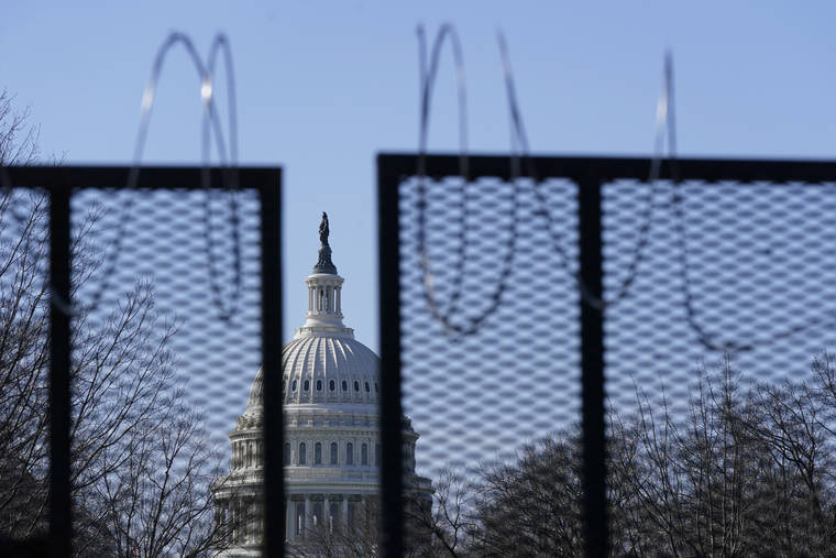 ASSOCIATED PRESS
                                The U.S. Capitol dome stood past partially-removed razor wire hanging from a security fence, March 20, on Capitol Hill in Washington. Authorities suggested for weeks in court hearings and papers that members of the Oath Keepers militia group planned their attack on the Capitol in advance in an effort to block the peaceful transition of power.