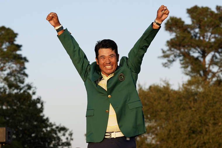 ASSOCIATED PRESS
                                Hideki Matsuyama, of Japan, celebrates after putting on the champion’s green jacket after winning the Masters golf tournament today in Augusta, Ga.