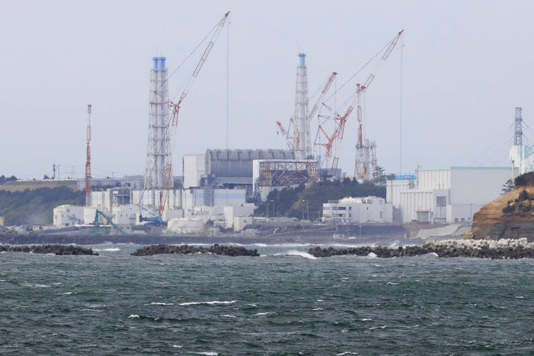 ASSOCIATED PRESS
                                Fukushima Daiichi nuclear power plant is seen from Namie town, Fukushima prefecture, north of Tokyo, Tuesday.