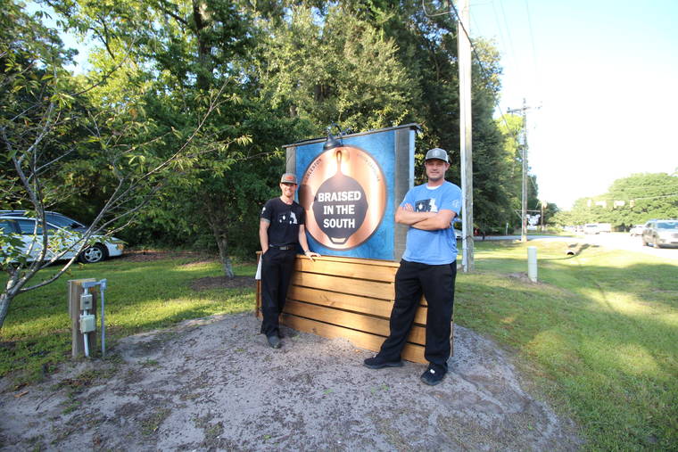 HANNAH ALBERT VIA ASSOCIATED PRESS
                                Steve Klatt, left, and Brandon Lapp, owners of Braised in the South, a Johns Island, S.C, restaurant and food truck business, posed for a photo Sept. 23. Klatt and Lapp are having trouble finding workers during the pandemic.