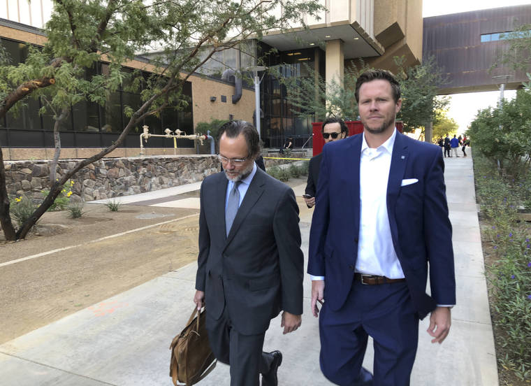 ASSOCIATED PRESS
                                Then-Maricopa County Assessor Paul Petersen, right, and his attorney, Kurt Altman, left a court hearing, in Nov. 2019, in Phoenix. The former Arizona politician could serve up to 15 years in prison for operating an illegal adoption scheme involving women from the Marshall Islands after he was given his third sentence, today, in Utah.