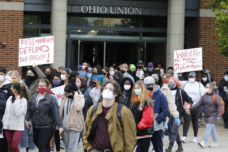 ASSOCIATED PRESS
                                Students leave the Ohio Union on the campus of Ohio State University to protest the shooting of Ma’Khia Bryant a day earlier by Columbus Police.