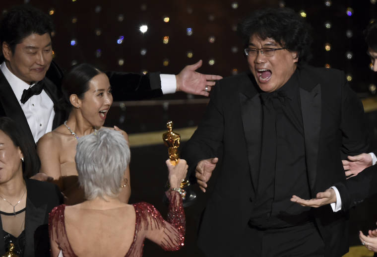 ASSOCIATED PRESS
                                Bong Joon Ho, right, reacted as he was presented with the award for best picture for “Parasite” from presenter Jane Fonda at the Oscars, in Feb. 2020, at the Dolby Theatre in Los Angeles. Looking on from left were Kang-Ho Song and Kwak Sin Ae.