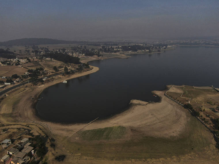 ASSOCIATED PRESS
                                An aerial view of Villa Victoria Dam, the main water supply for Mexico City residents, on the outskirts of Toluca, Mexico, today.