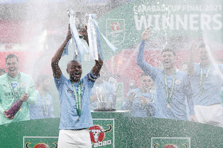 ASSOCIATED PRESS
                                Manchester City’s team captain Fernandinho lifts the trophy at the end of the English League Cup final soccer match between Manchester City and Tottenham Hotspur at Wembley stadium in London, today. Manchester City won 1-0.