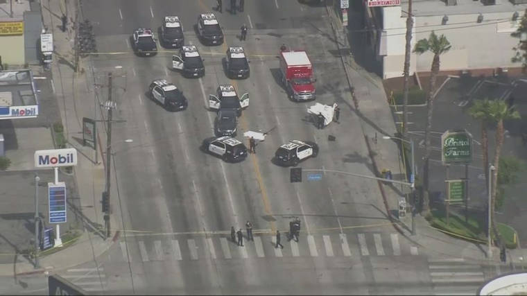 ASSOCIATED PRESS
                                This aerial image from video courtesy KTTV FOX 11 Los Angeles shows the scene of an officer-involved shooting in Los Angeles on Saturday. Police said officers shot and killed a man wearing body armor who drove his car into a police cruiser on a busy Hollywood thoroughfare.