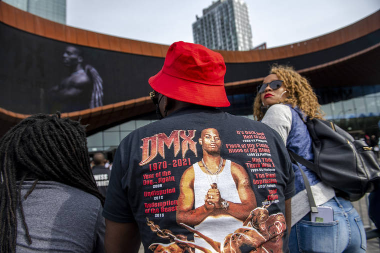 ASSOCIATED PRESS
                                People gather for a “Celebration of Life Memorial” for rapper DMX at Barclays Center, Saturday, in the Brooklyn borough of New York. DMX, whose birth name is Earl Simmons, died April 9 after suffering a “catastrophic cardiac arrest.”