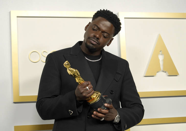 ASSOCIATED PRESS
                                Daniel Kaluuya, winner of the award for best actor in a supporting role for “Judas and the Black Messiah,” poses in the press room at the Oscars on Sunday at Union Station in Los Angeles.