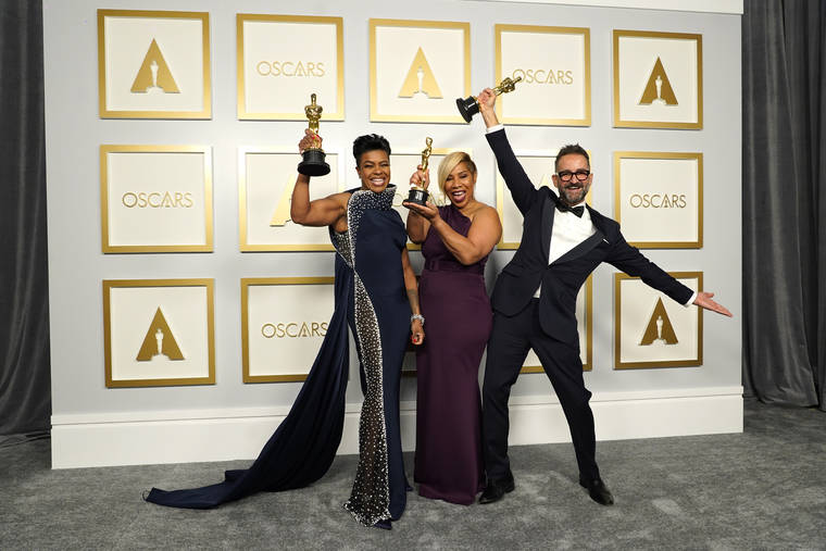 ASSOCIATED PRESS
                                Mia Neal, from left, Jamika Wilson and Sergio Lopez-Rivera, winners of the award for best makeup and hairstyling for “Ma Rainey’s Black Bottom,” pose in the press room at the Oscars on Sunday, April 25, 2021, at Union Station in Los Angeles.