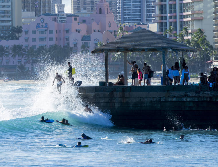 STAR-ADVERTISER / 2020
                                With high surf, Waikiki was packed with surfers, boogie boarders and sunbathers.