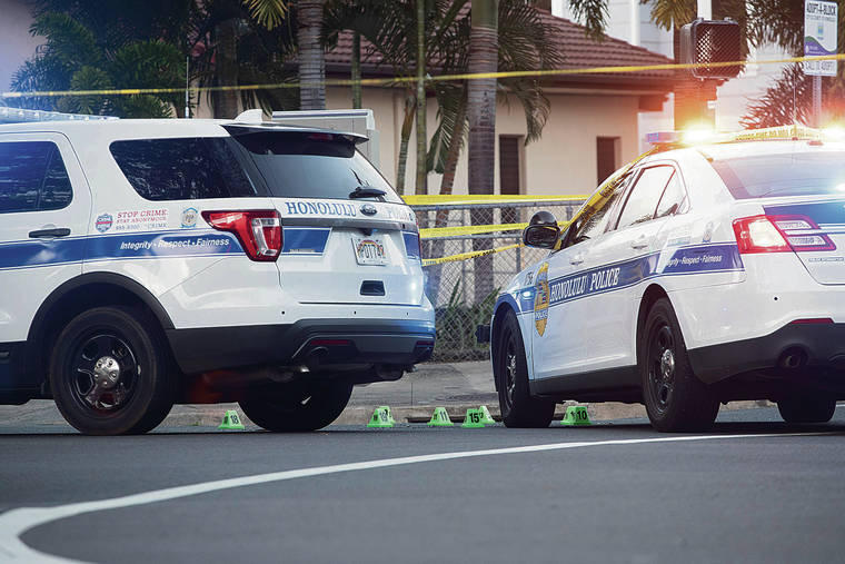 CINDY ELLEN RUSSELL / CRUSSELL@STARADVERTISER.COM
                                Evidence markers were placed on Kalakaua Avenue as the Honolulu Police Department investigated the fatal shooting of 16-year-old Iremamber Sykap by officers on April 5.