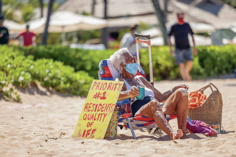 BRYAN BERKOWITZ / SPECIAL TO THE STAR-ADVERTISER
                                Kihei resident Dorothy McCoy, 93, found a spot on Wailea Beach on Saturday for the “Take Back Our Beach” event organzied by residents.