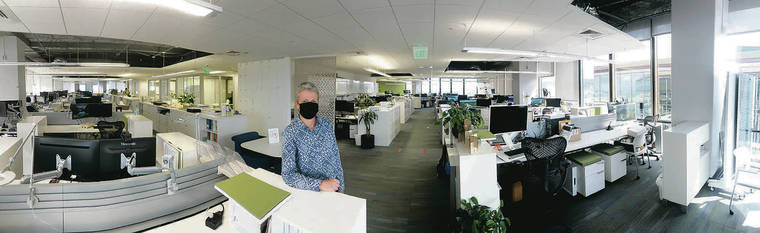 CRAIG T. KOJIMA / CKOJIMA@STARADVERTISER.COM
                                Bettina Mehnert, CEO of architectural firm AHL, stands in the middle of the firm’s empty office at the Pacific Guardian Center. Most of the employees continue to work from home.