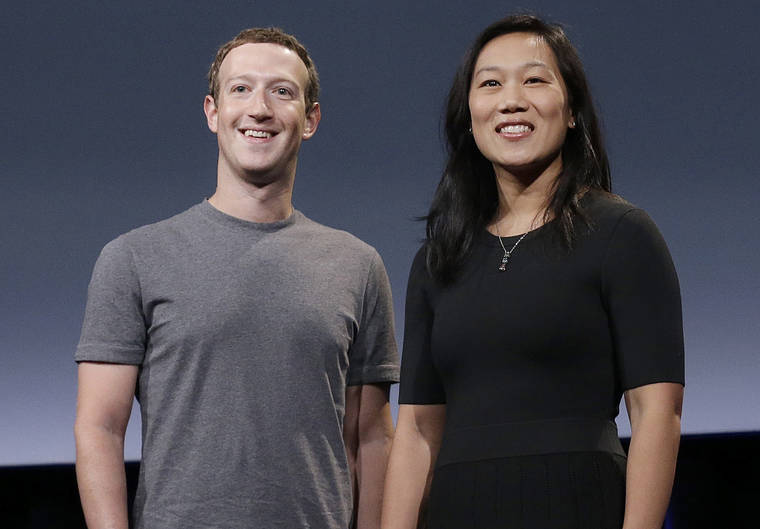 ASSOCIATED PRESS
                                Facebook CEO Mark Zuckerberg and his wife, Priscilla Chan, smile as they prepare for a speech in San Francisco in 2016.