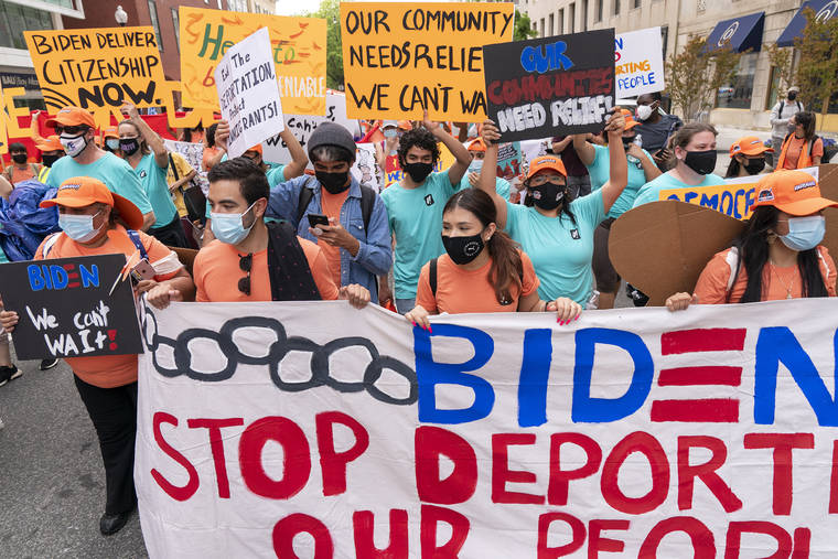 ASSOCIATED PRESS
                                Supporters of immigration reform march while asking for a path to citizenship and an end to detentions and deportations today in Washington.