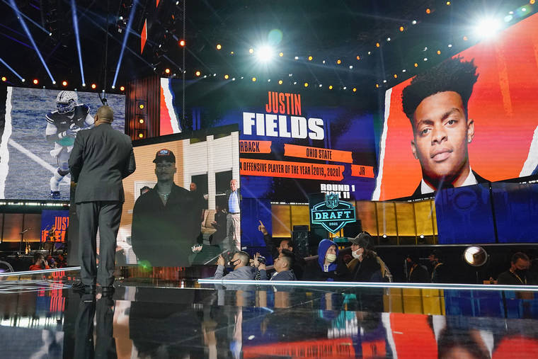 ASSOCIATED PRESS
                                An image of Ohio State quarterback Justin Fields is displayed after he was chosen by the Chicago Bears with the 11th pick in the first round of the NFL Draft.
