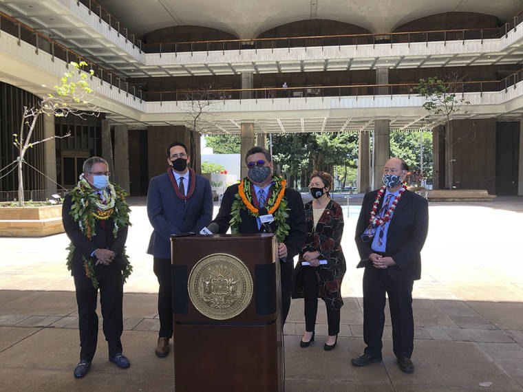 ASSOCIATED PRESS
                                Hawaii Senate President Ron Kouchi speaks at a podium at the state Capitol on Thursday, flanked from left to right by Sens. Kalani English, Jarrett Keohokalole, Michelle Kidani and Brian Taniguchi.