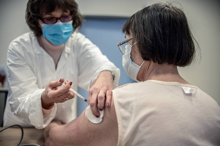 NEW YORK TIMES / MARCH 19
                                A patient receives the AstraZeneca coronavirus vaccine in Budapest, Hungary.