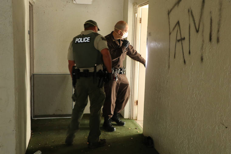 COURTESY DLNR
                                Officers from the Department of Land and Natural Resources’ Division of Conservation and Resources Enforcement, Hawaii County Police Department and the Sheriffs Division went through the Hilo hotel’s 146 rooms and found evidence of squatters.