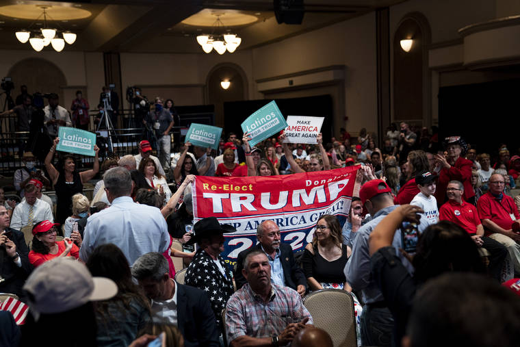 NEW YORK TIMES / 2020
                                Attendees cheer as President Donald Trump arrives for a Latinos for Trump Coalition roundtable campaign event at Arizona Grand Resort & Spa in Phoenix.
