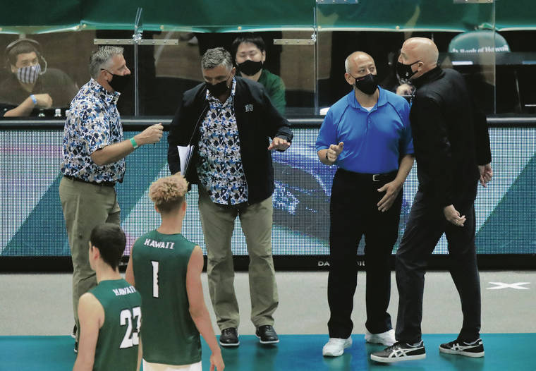 JAMM AQUINO / JAQUINO@STARADVERTISER.COM 
                                Hawaii head coach Charlie Wade, left, and Long Beach State head coach Alan Knipe, far right, exchanged words during Saturday’s match at SimpliFi Arena at Stan Sheriff Center. The argument occurred over a sound level in the arena.