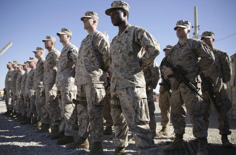 ASSOCIATED PRESS
                                U.S. Marines watch during the change of command ceremony at Task Force Southwest military field in Shorab military camp of Helmand province, Afghanistan, in 2018.