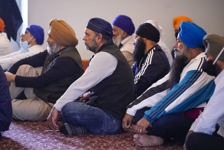 ASSOCIATED PRESS / APRIL 17
                                Members of the Sikh Coalition gather at the Sikh Satsang of Indianapolis in Indianapolis to formulate the group’s response to the shooting at a FedEx facility in Indianapolis that claimed the lives of four members of the Sikh community. A gunman killed eight people and wounded several others before taking his own life in a late-night attack at a FedEx facility near the Indianapolis airport.