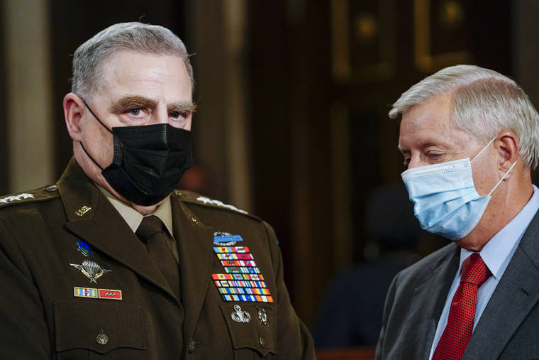 Joint Chiefs Chairman Gen. Mark Milley, left, and Sen. Lindsey Graham, R-S.C., talk as they arrive the chamber ahead of President Joe Biden speaking to a joint session of Congress, Wednesday, April 28, 2021, in the House Chamber at the U.S. Capitol in Washington. (Melina Mara/The Washington Post via AP, Pool)