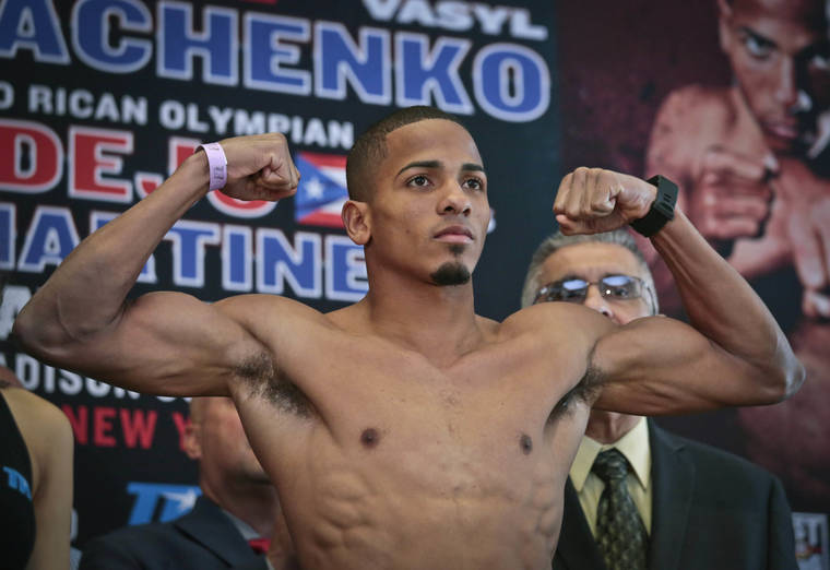 ASSOCIATED PRESS
                                Puerto Rican boxer Felix Verdejo posed after his weigh-in at Madison Square Garden in New York, in June 2016. Verdejo turned himself in to federal agents to face charges hours after authorities identified the body of a dead woman as his 27-year-old pregnant lover, officials said.
