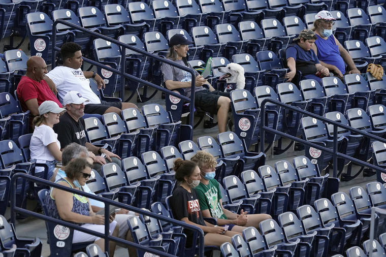 ASSOCIATED PRESS
                                Fans are socially distanced during the first inning of a Low A Southeast League baseball game between the Dunedin Blue Jays and the Tampa Tarpons at George M. Steinbrenner Field.