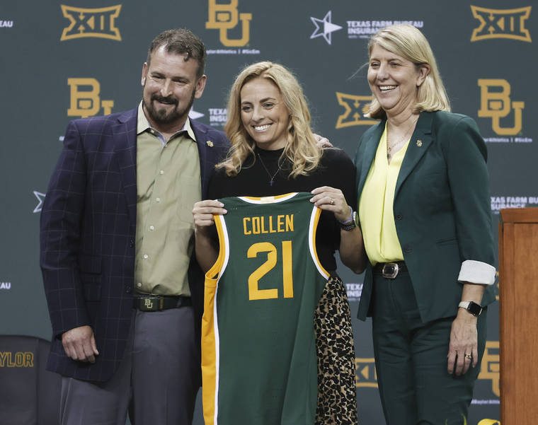 WACO TRIBUNE-HERALD VIA AP
                                Nicki Collen, center, holds up a jersey while bring introduced as the new Baylor women’s head basketball coach by school president Linda Livingstone, right, and athletic director Mack Rhoades.