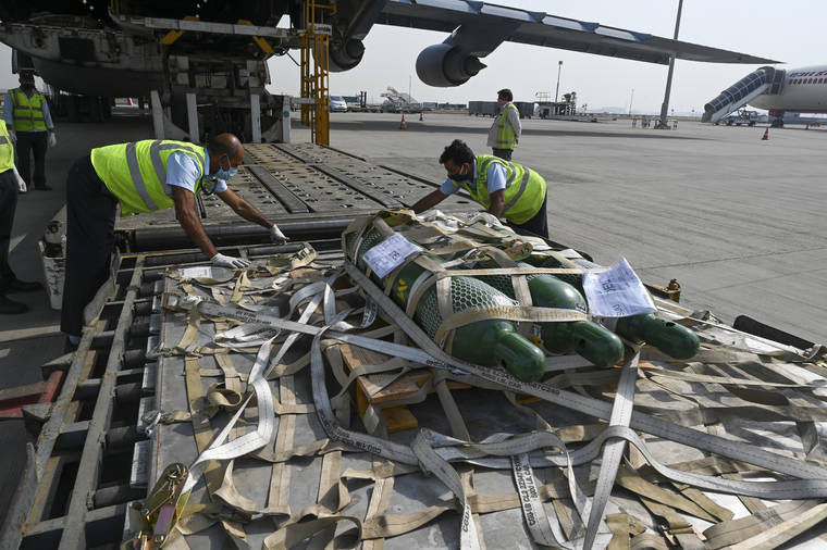 POOL VIA AP
                                Relief supplies from the United States in the wake of India’s COVID-19 situation arrive at the Indira Gandhi International Airport cargo terminal in New Delhi, India, on Friday.
