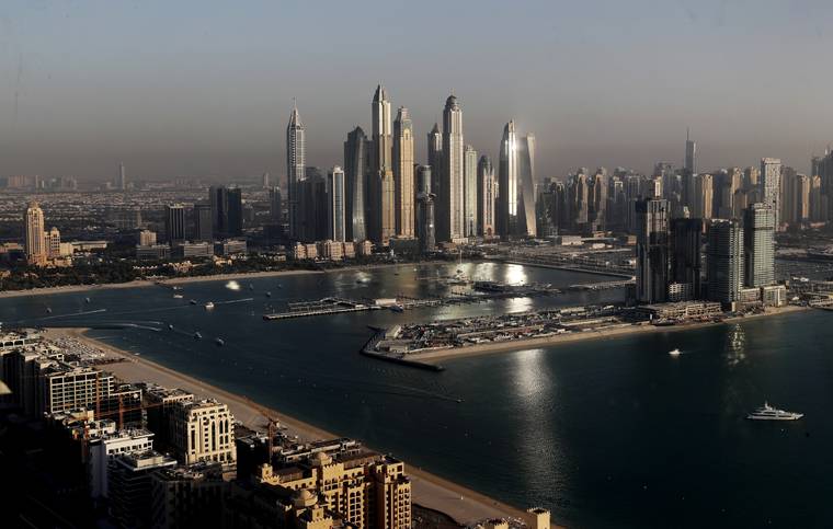 ASSOCIATED PRESS
                                Luxury towers dominate the skyline in the Marina district, center, and the new Dubai Harbour development, right, are seen from the observation deck of “The View at The Palm Jumeirah” in Dubai, United Arab Emirates.