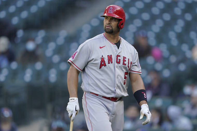 ASSOCIATED PRESS
                                Los Angeles Angels’ Albert Pujols walks to the dugout after he was called out on strikes during the ninth inning of a baseball game against the Seattle Mariners, Sunday, in Seattle.