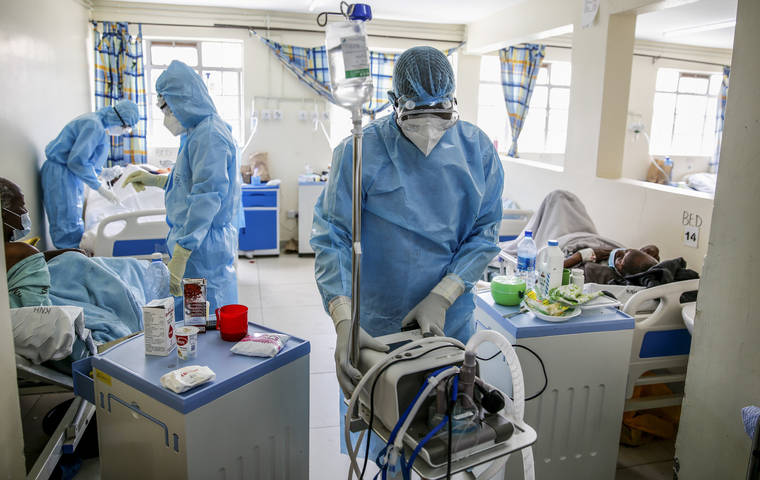 ASSOCIATED PRESS
                                Medical workers tend to coronavirus patients in the COVID-19 intensive care unit at Kenyatta National Hospital, in Nairobi, Kenya, on April 14.