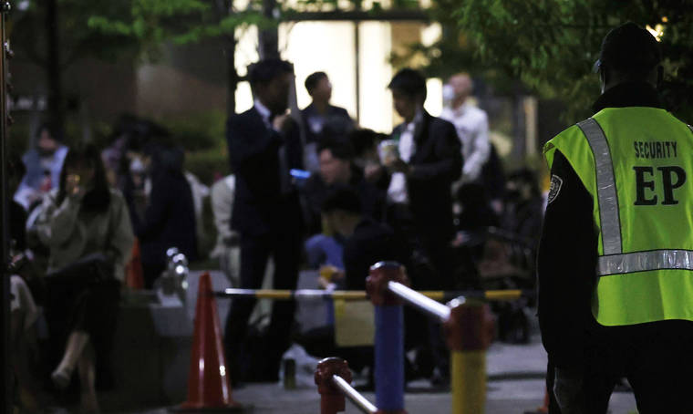 TAKUTO KANEKO/KYODO NEWS VIA ASSOCIATED PRESS
                                A security person stood guard as people drank at a park in Tokyo on April 21. Trains packed with commuters returning to work after a weeklong national holiday. Frustrated young people drinking in the streets because bars are closed. Protests planned over a possible visit by the Olympics chief. As the coronavirus spreads in Japan ahead of the Tokyo Olympics starting in 11 weeks, one of the world’s least vaccinated nations is showing signs of strain, both societal and political.