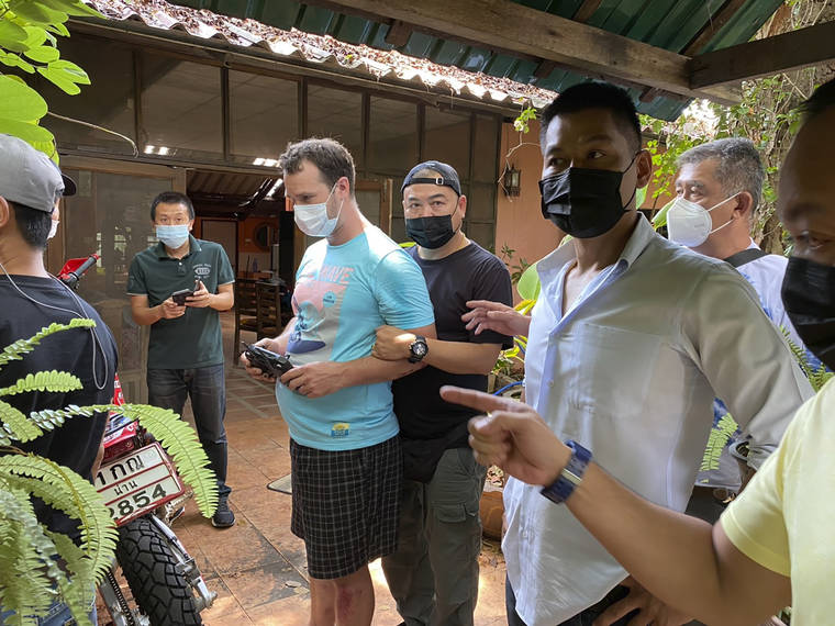 THAI PROVINCIAL POLICE REGION 5 VIA ASSOCIATED PRESS
                                Police arrested and interrogated American citizen Jason Matthew Balzer, center, Thursday in Chiang Mai province northern Thailand before charging him for intentionally murdering his pregnant wife in Nan province.