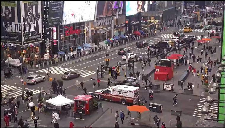 ASSOCIATED PRESS
                                In this image taken from video by the FDNY, pedestrians hurry away from the scene of a shooting in Times Square, Saturday, in New York. New York City police say three innocent bystanders including a 4-year-old girl who was toy shopping were shot. All the victims are expected to recover.