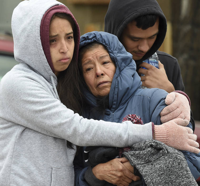 JERILEE BENNETT/THE GAZETTE VIA ASSOCIATED PRESS
                                Family members mourned at the scene where their loved ones were killed, early Sunday, in Colorado Springs, Colo. The suspected shooter was the boyfriend of a female victim at the party attended by friends, family and children.