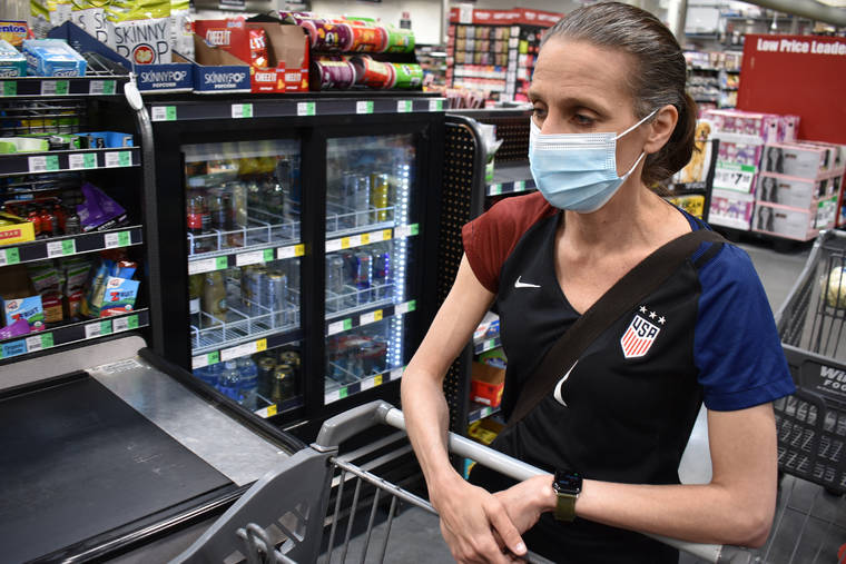 ASSOCIATED PRESS
                                Crystal Dvorak shopped at WinCo Foods, Saturday, in Billings, Mont. Dvorak lost her job as an audiologist. The day Montana Gov. Greg Gianforte announced the $300 benefit would end June 27 was Dvorak’s second day of unemployment.