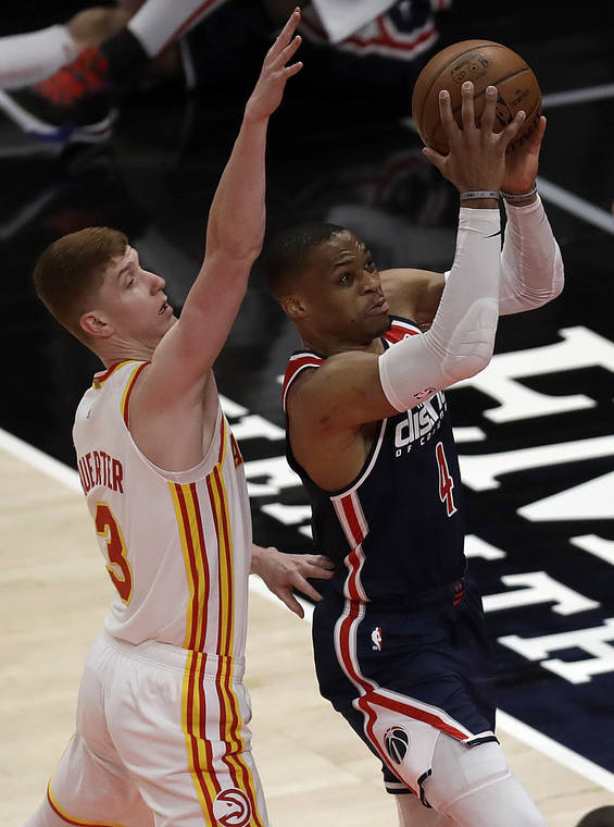 ASSOCIATED PRESS
                                Washington Wizards’ Russell Westbrook shoots past Atlanta Hawks’ Kevin Huerter during the first half of an NBA basketball game, today, in Atlanta.