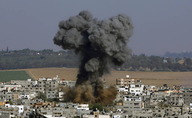 ASSOCIATED PRESS
                                Smoke rises after an Israeli airstrike in Gaza City today.