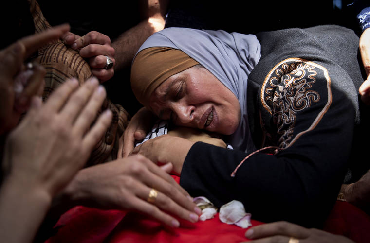 ASSOCIATED PRESS
                                A Palestinian woman mourned over her son Rasheed Abu Arra, who was killed in clashes with Israeli forces, during his funeral in the Village of Aqqaba near the West Bank town of Tubas, today.