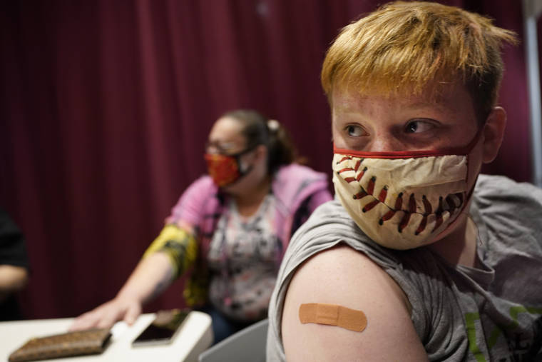 ASSOCIATED PRESS
                                Jacob Conary, 15, listened to advice from a medical assistant after receiving his first shot of the COVID-19 vaccination, today, in Auburn, Maine. Vaccination clinics in Maine recently opened up to 12 to 15-year-olds.