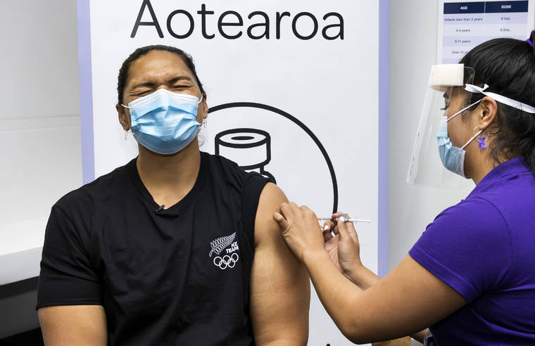 ASSOCIATED PRESS / APRIL 17
                                New Zealand olympian shot putter Dame Valerie Adams reacts as she receives her COVID-19 vaccination in Auckland, New Zealand.
